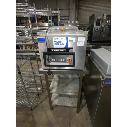 2185 - A commercial stainless steel vacuum packing machine by Turbovac, comes on a stand with 2 shelves 240... 