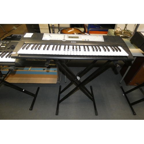 3302 - A Yamaha portable keyboard model YPT-200 no power adapter, comes with a stand - trade. Tested workin... 