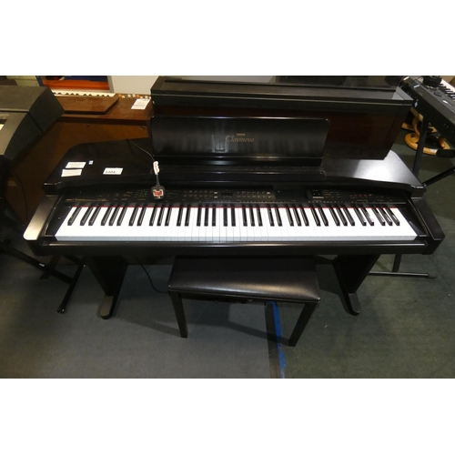 3304 - An electric Yamaha digital piano model Clavinova CVP-65, comes with: power cable, a built in stand a... 