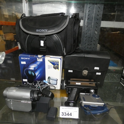 3344 - A Sony handy cam, DCR-DVD110e, with case charger and 2 x batteries, a Chinon 8mm camera and a pocket... 