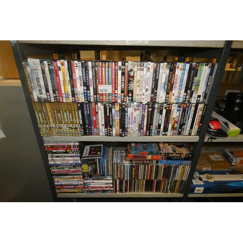 3418 - A large quantity of various DVDs & CDs, contents of 2 shelves