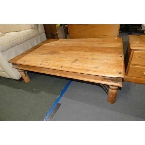 3150 - 2 dark wood coffee tables both with metal stud decoration comprising 1 at approx 90 x 135cm and 1 at... 