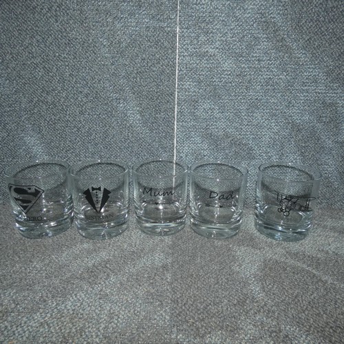 3210 - A quantity of Birthday/wedding day/special occasion gift/novelty glass tumblers. Contents of 1 shelf