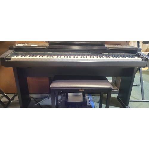 3304 - An electric Yamaha digital piano model Clavinova CVP-65, comes with: power cable, a built in stand a... 