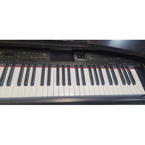 3304 - An electric Yamaha digital piano model Clavinova CVP-65, comes with: power cable, a built in stand a... 