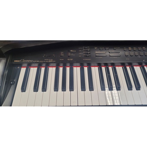 3304 - An electric Yamaha digital piano model Clavinova CVP-65, comes with: power cable, a built in stand a... 