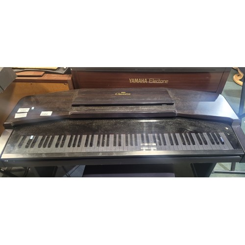 3304 - An electric Yamaha digital piano model Clavinova CVP-65, comes with: power cable, a built in stand a... 