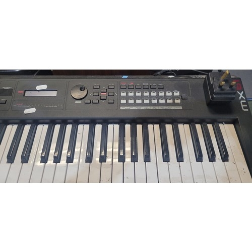 3305 - A Yamaha portable usb/midi keyboard model MX-61music synthesizer, comes with a stand -trade