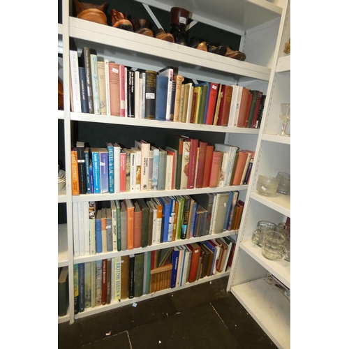 4073 - A large quantity of miscellaneous hardback and paperback books (6 lower shelves)