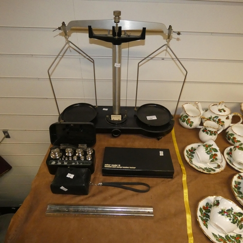 4164 - A vintage Bakelite and steel chemists balance with weights, a spring balance & a vintage camera
