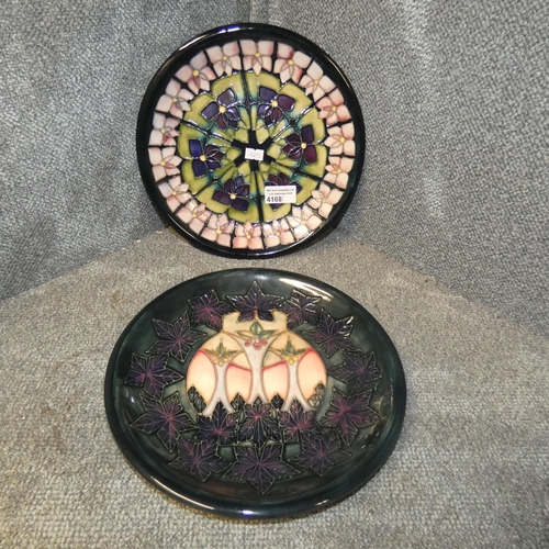 4168 - A blue ground Moorcroft stylised floral plate and a Moorcroft Sally Tuffin Cluny design plate