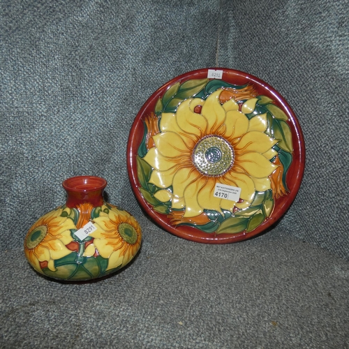 4170 - A Moorcroft Inca patterned plate decorated with a large sunflower and a smaller matching vase