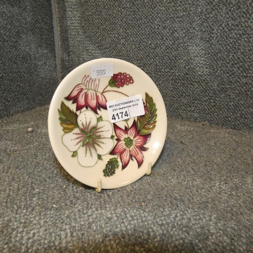 4174 - A small cream ground floral patterned Moorcroft saucer