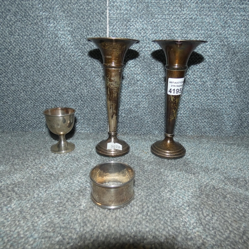 4195 - A pair of 20th century silver trumpet shaped vases, a silver egg cup and a silver serviette ring