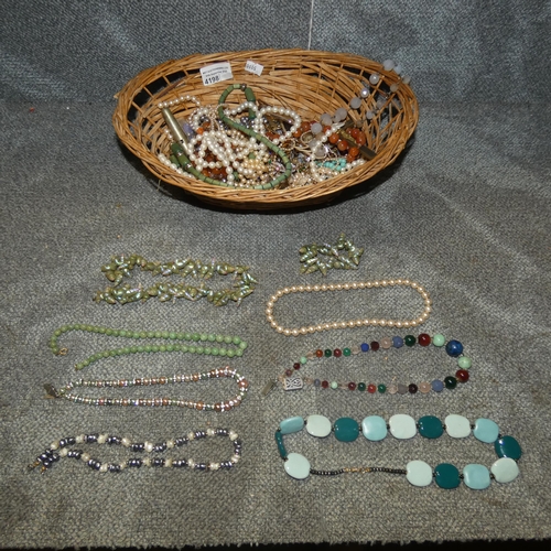 4198 - A quantity of miscellaneous costume jewellery (basket not included)