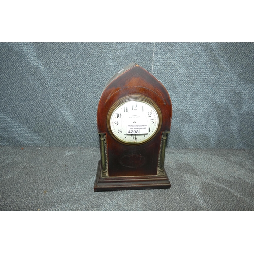 4208 - An Edwardian ecclesiastical style mahogany cased mantel clock with side columns
