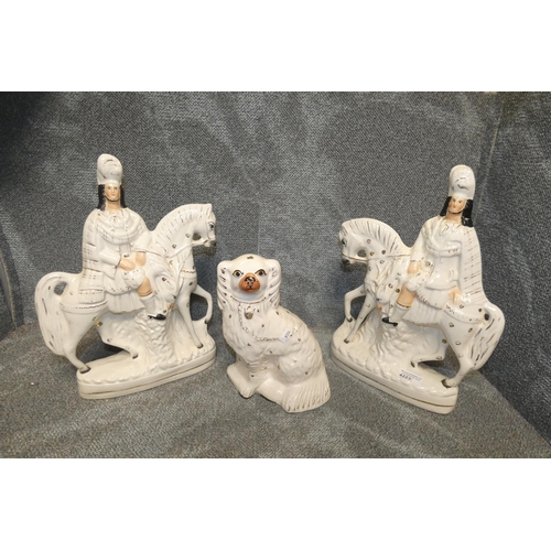 4223 - A pair of Staffordshire flat backs of Highlanders on horses and Staffordshire dog