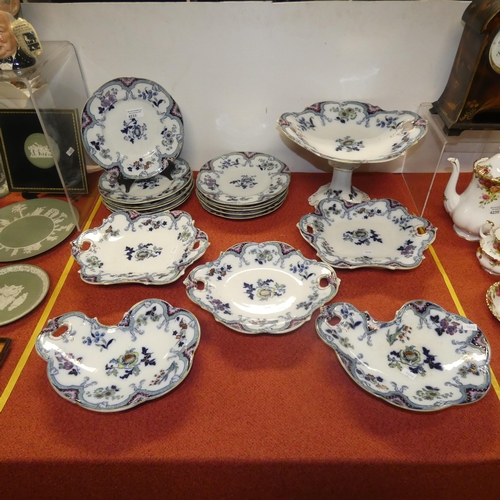 4233 - A blue floral patterned 17 piece Sutherland fruit set with plates and comports