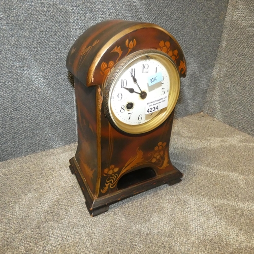 4234 - An art nouveau floral patterned wooden case mantel clock