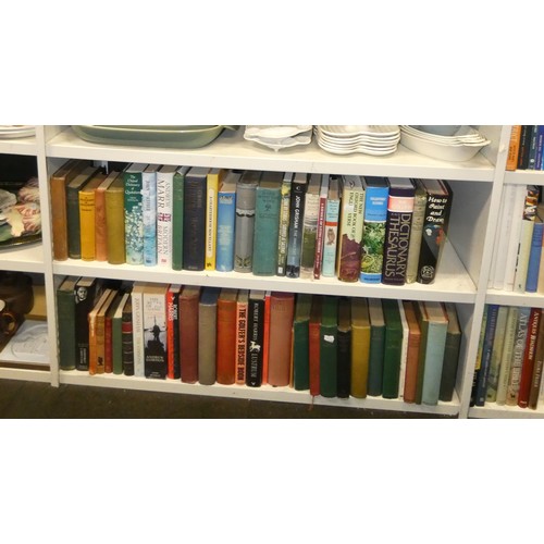4073 - A large quantity of miscellaneous hardback and paperback books (6 lower shelves)