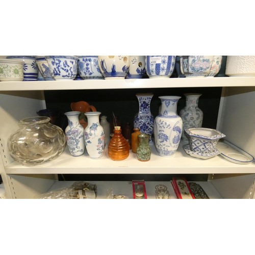 4106 - A quantity of miscellaneous mainly blue and white vases, small jardinieres, jugs and bottles (2 shel... 