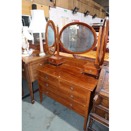 4512 - An Edwardian inlaid mahogany dressing chest with a triple mirror, two trinket drawers, two short and... 