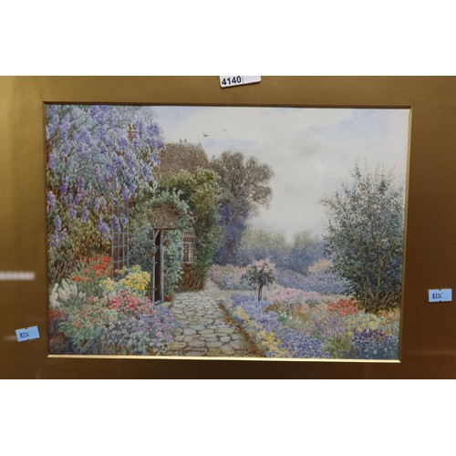 4140 - A pair of gilt framed watercolours of country cottage garden scenes by James Matthews