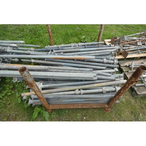 5571 - A large quantity of Cuplock scaffolding, poles and scaffold clips, contents of two stillages (which ... 