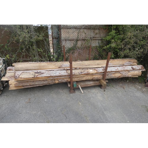 5595 - A quantity of waney edge boards, contents of 1 metal stillage which is not included