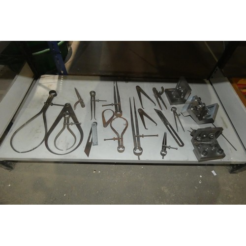 5482 - A quantity of various engineering related items including a set of wad punches, callipers etc. Conte... 