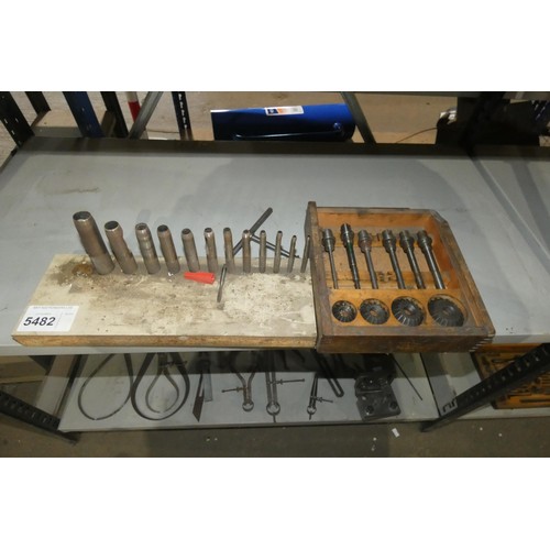 5482 - A quantity of various engineering related items including a set of wad punches, callipers etc. Conte... 