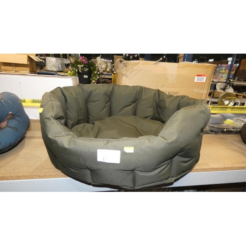 21 - A dark green pet bed