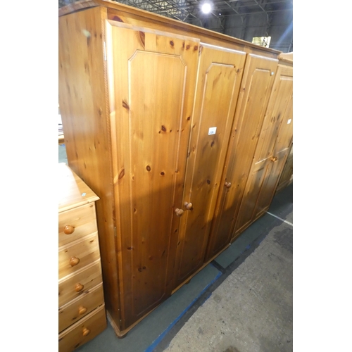 2120 - A pine triple door wardrobe approx 128 x 55 x 178cm high