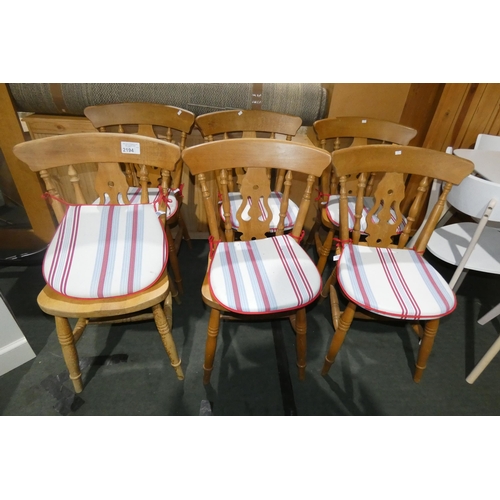 2194 - A set of six wooden dining chairs with striped tie on seat cushions