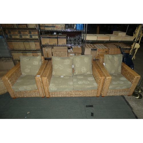 2197 - A conservatory type three piece suite comprising of a two person sofa approx 137cm wide, 2 matching ... 