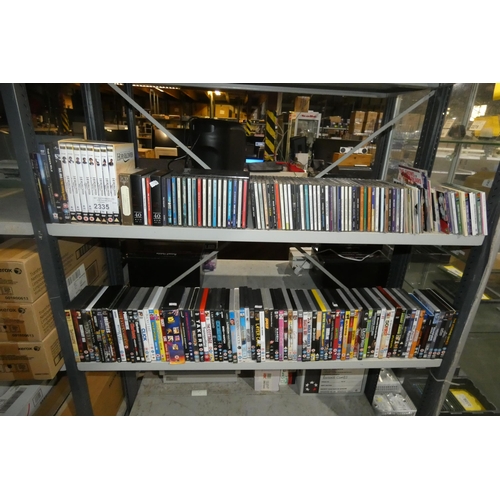 2335 - A quantity of various DVDs & CDs, contents of 2 shelves