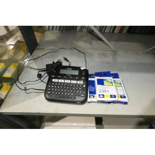 2391 - A Brother P-touch D210 label printer, with spare cassettes - trade