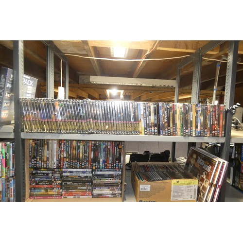 2332 - A large quantity of various DVDs and CDs, many still sealed , contents of 3 shelves