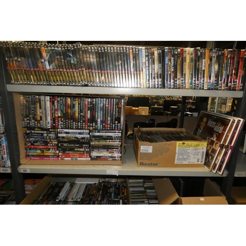 2332 - A large quantity of various DVDs and CDs, many still sealed , contents of 3 shelves