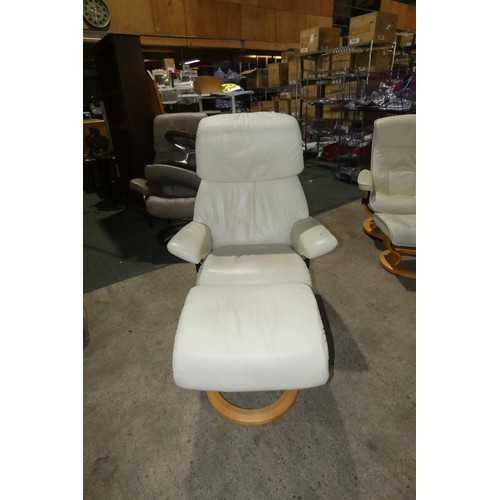 2230 - 1 Stressless cream upholstered swivelling reclining arm chair with matching footstool.
Height 111cm ... 