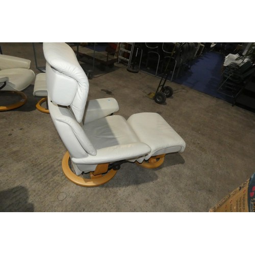 2230 - 1 Stressless cream upholstered swivelling reclining arm chair with matching footstool.
Height 111cm ... 