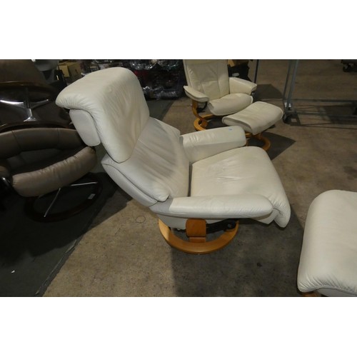 2230 - 1 Stressless cream upholstered swivelling reclining arm chair with matching footstool.
Height 111cm ... 