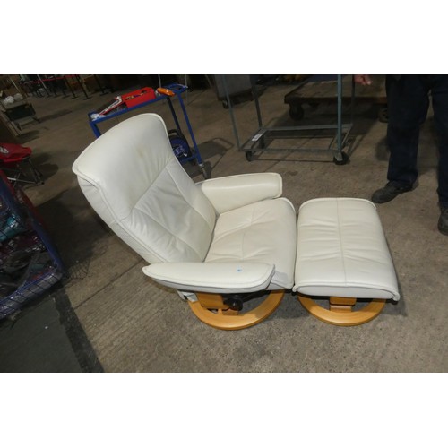 2231 - 1 Stressless cream upholstered swivelling reclining arm chair with matching footstool.
Height 95cm  ... 