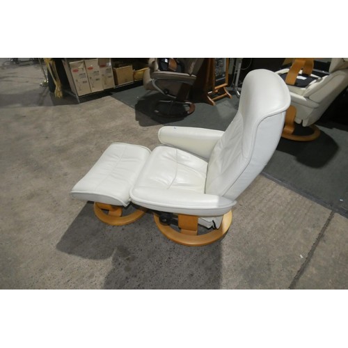 2231 - 1 Stressless cream upholstered swivelling reclining arm chair with matching footstool.
Height 95cm  ... 