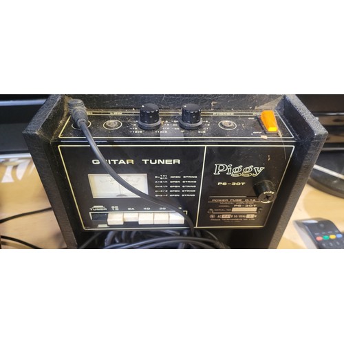 2454A - A piggy guitar amp and guitar tuner trade