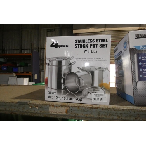 1018 - A unused 4 piece stainless steel pot set with lids, boxed