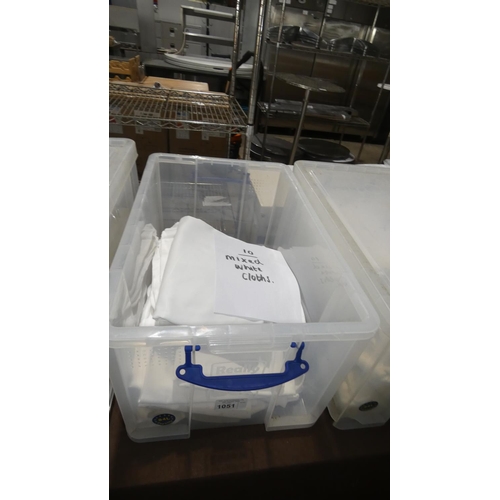 1051 - A quantity of 10 various size white table cloths, contents of 1 plastic crate