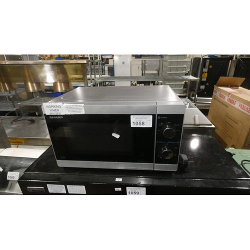 1058 - A microwave oven by Sharp - trade. TESTED WORKING