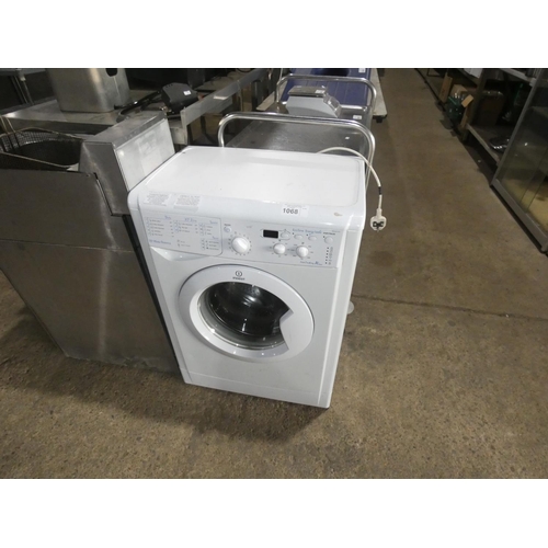 1068 - A slimline under counter washing machine by Indesit 6kg - trade