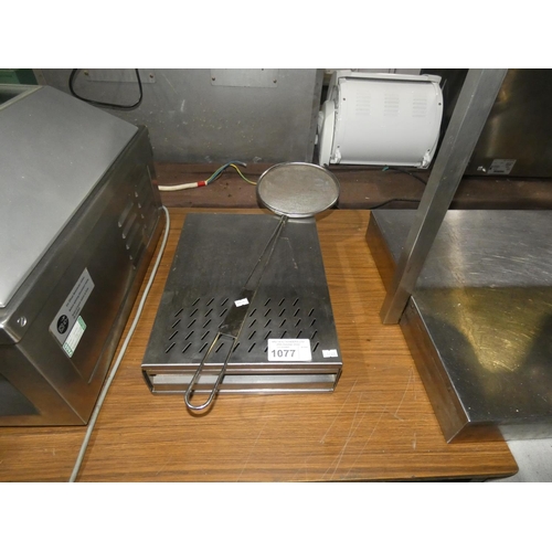 1077 - A stainless steel knock out box and large strainer